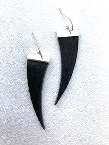 Leather tooth earring. 
