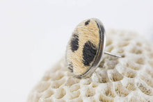 Fur stud earring with wild cat pattern. Image by Alex and Matt Creative.